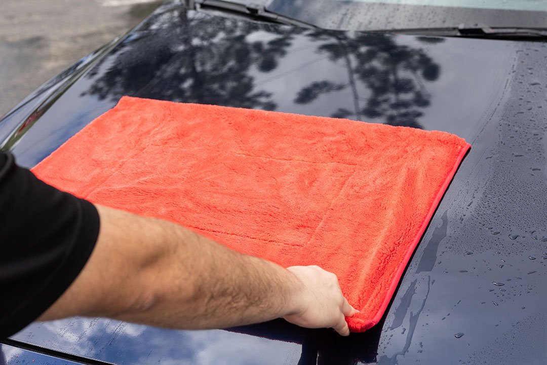 1000GSM Big Red Microfiber Drying Towel on Car Hood