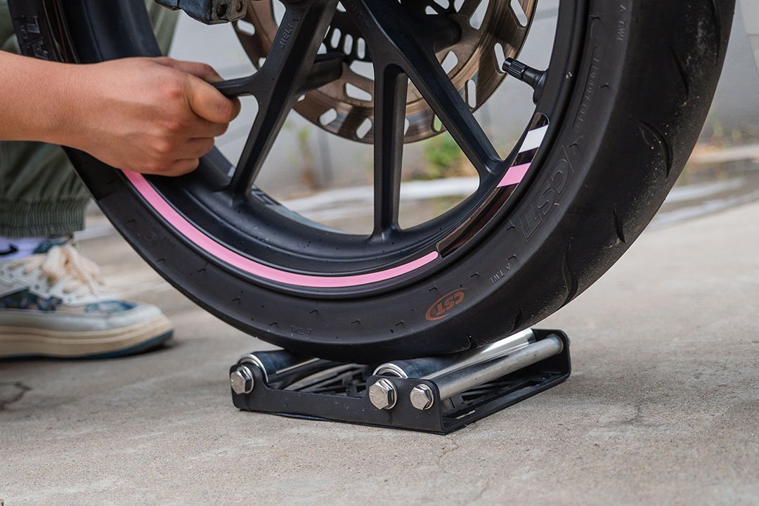 Motorcycle Stand Putting on Wheel